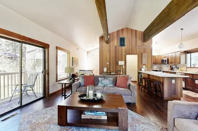 a living room with a couch and a table at Lakeshore Townhome 20 in Incline Village