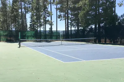 a tennis court with a net on top of it at Lake Village Townhouse B in Zephyr Cove