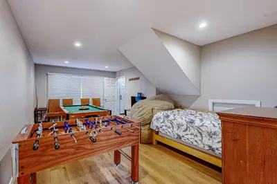a bedroom with a bed and a foosball table at Allen Way Escape in Incline Village