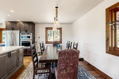 a kitchen with a dining room table with chairs at Tyner Dreams in Incline Village