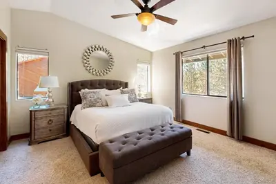 a bedroom with a bed and a ceiling fan at Tyner Dreams in Incline Village