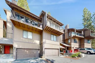 a apartment building with a balcony and a garage at Katherine Court Townhouse in Stateline