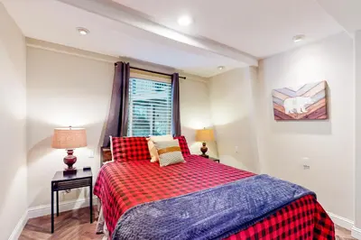 a small bedroom with a bed and a window at Boothill Adventures in Incline Village