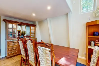 a dining room with a wooden table and chairs at Boothill Adventures in Incline Village