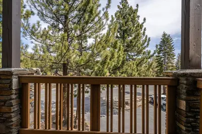 a balcony with a view of trees at New Listing 2 bedroom and Loft 2 bath Summit E Bldg 12 condo sleeps 8 Steps to Eagle Lodge Chair 15 in Mammoth Lakes