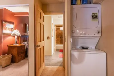 a laundry room with a washer and dryer in a house at New Listing 2 bedroom and Loft 2 bath Summit E Bldg 12 condo sleeps 8 Steps to Eagle Lodge Chair 15 in Mammoth Lakes