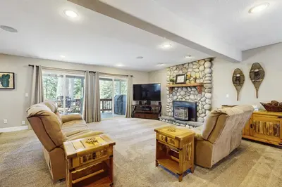 a living room with two couches and a fireplace at Skyline Manor in South Lake Tahoe
