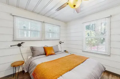 a bedroom with a bed and a ceiling fan at Manzanita Holiday 4 in South Lake Tahoe