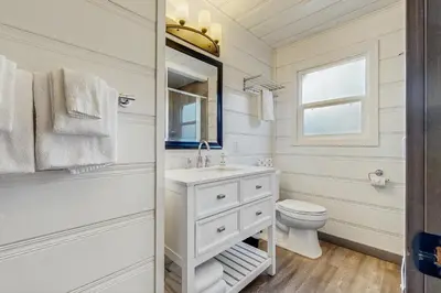 a white bathroom with a sink and a toilet at Manzanita Holiday 4 in South Lake Tahoe