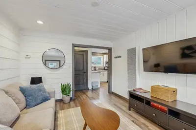 a living room with a couch and a tv at Manzanita Holiday 4 in South Lake Tahoe