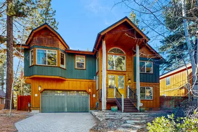 a large house with a green garage at Koyukon Escape in South Lake Tahoe