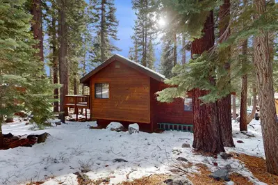 a small cabin in the woods in the snow at Cozy Tahoe Donner Retreat in Truckee