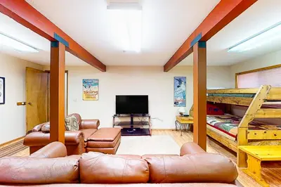 a living room with a couch and a bunk bed at St Bernard Oasis in Truckee