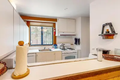 a kitchen with white cabinets and a counter top at Aspen Grove Escape in Truckee