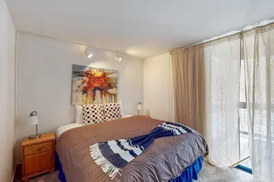 a bedroom with a bed and a window at Aspen Grove Escape in Truckee