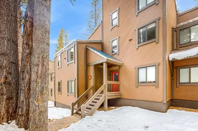a house with a staircase in front of it at Aspen Grove Escape in Truckee