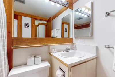 a bathroom with a sink and a mirror at Aspen Grove Escape in Truckee