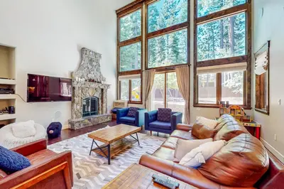 a living room with a couch and a fireplace at Cochise Charms in South Lake Tahoe