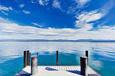 a view of a large body of water with a dock at Alpine Haven in Tahoe City