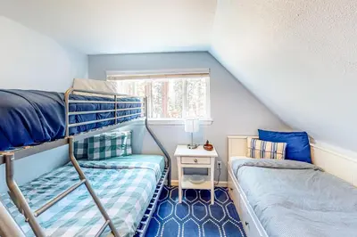 a room with two bunk beds and a window at Golden Adventures in Kings Beach