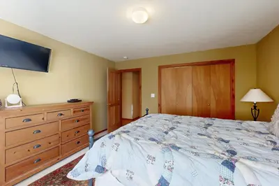 a bedroom with a bed and a dresser and a tv at Silverado Escape in Tahoe City