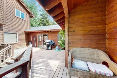 a porch with a wicker chair on a deck at Silverado Escape in Tahoe City