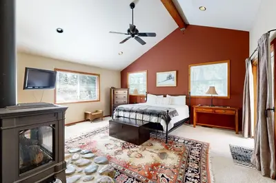 a bedroom with a bed and a fireplace at Silverado Escape in Tahoe City