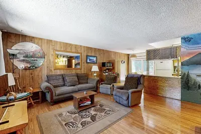 a living room with a couch and a table at Pineland Escape in Tahoe City
