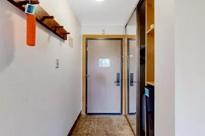 a hallway with a door leading to a room at Northstar Resort 207 in Truckee