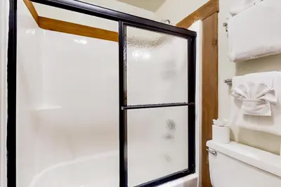 a bathroom with a shower with a glass door at Northstar Resort 207 in Truckee