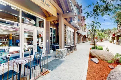 a building with a table and chairs outside of it at Northstar Resort 207 in Truckee