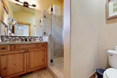 a bathroom with a shower and a sink and a toilet at Sagebrush Charms in Truckee