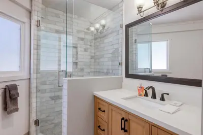 a bathroom with a sink and a glass shower at Dodawah Oasis in Carnelian Bay