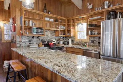 a kitchen with wooden cabinets and a granite counter top at Dodawah Oasis in Carnelian Bay