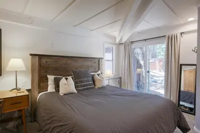 a bedroom with a large bed and a window at Dodawah Oasis in Carnelian Bay