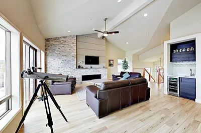 a camera tripod in a living room with a couch at Tahoe Keys Haven in South Lake Tahoe