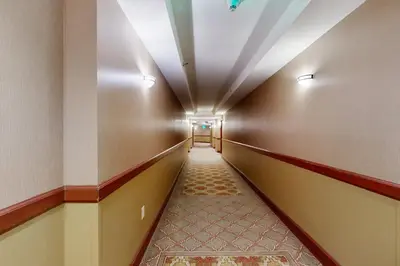 a hallway in a building with a long corridor at Resort at Squaw Creek's 521 in Olympic Valley