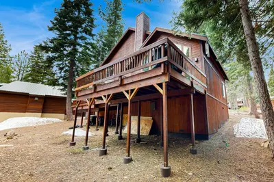 a house with a deck on top of it at Tahoe Donner Snow Globe in Truckee