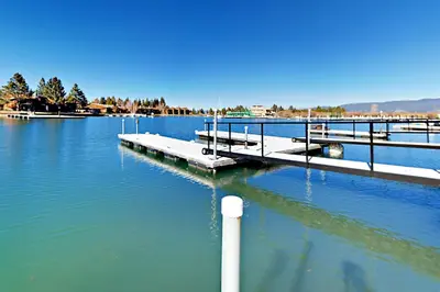 a dock in the middle of a body of water at Cove 141 in South Lake Tahoe