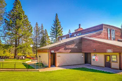 a house with a garage in a yard at Northwoods Paradise in Truckee