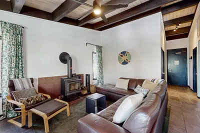 a living room with a couch and a wood stove at Scott Peak Lodges Condo in Alpine Meadows