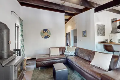 a living room with a brown leather couch at Scott Peak Lodges Condo in Alpine Meadows