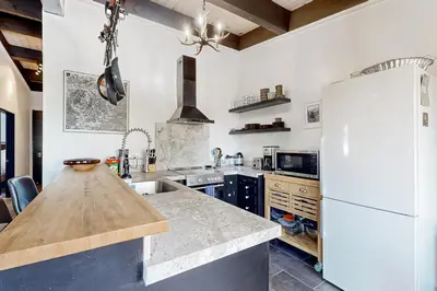 a kitchen with a white refrigerator and a counter at Scott Peak Lodges Condo in Alpine Meadows