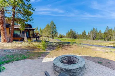 a fire pit in front of a house at Henness Haven in Truckee