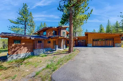 a wooden house with a driveway in front of it at Henness Haven in Truckee