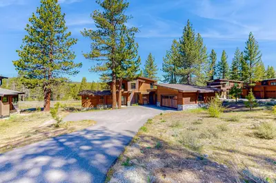 a home with a driveway leading to a house at Henness Haven in Truckee