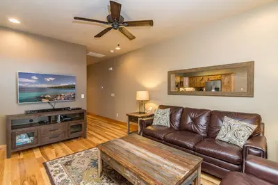 a living room with a couch and a ceiling fan at Walk-Friendly Truckee House in Truckee