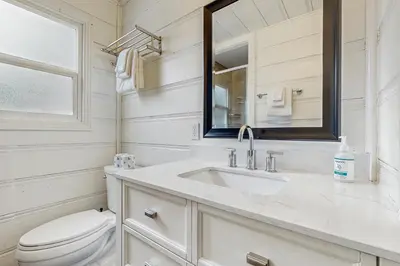 a white bathroom with a sink and a toilet at Manzanita Holiday 5 in South Lake Tahoe