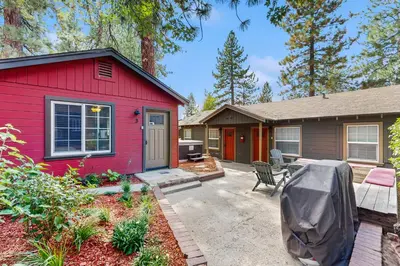 a red house with a patio in front of it at Manzanita Holiday 5 in South Lake Tahoe