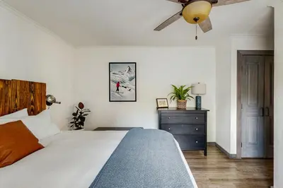 a bedroom with a bed and a ceiling fan at Manzanita Holiday 2 in South Lake Tahoe